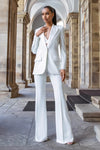 Woman wearing white blazer and trouser suit