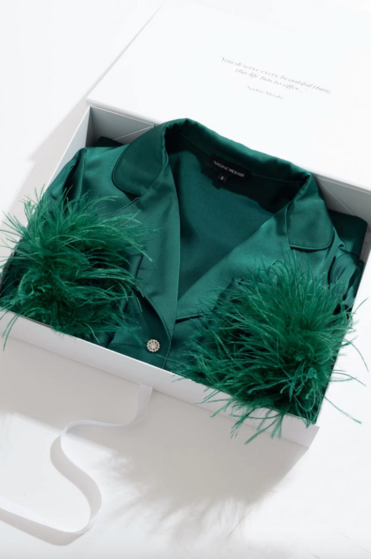 Darcie green pyjamas inside white open box