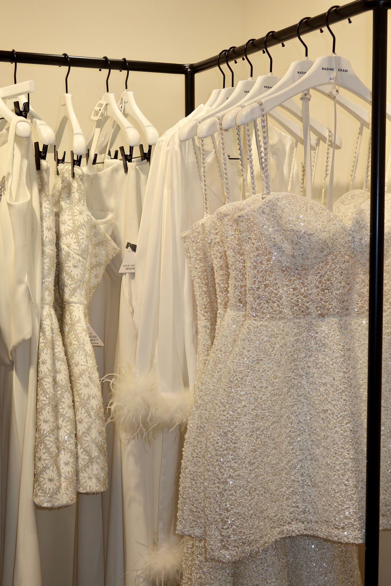 Collection of dresses on hangers in a store setting