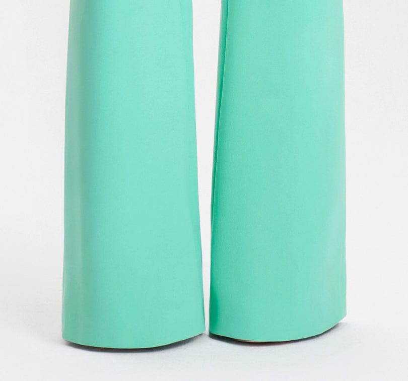 Pair of turquoise pants on a white background