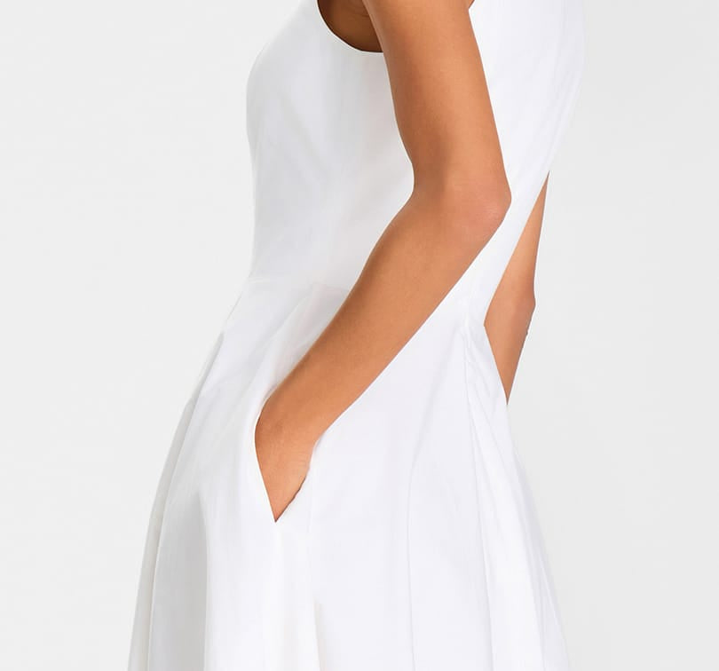 White dress with a deep neckline on a white background