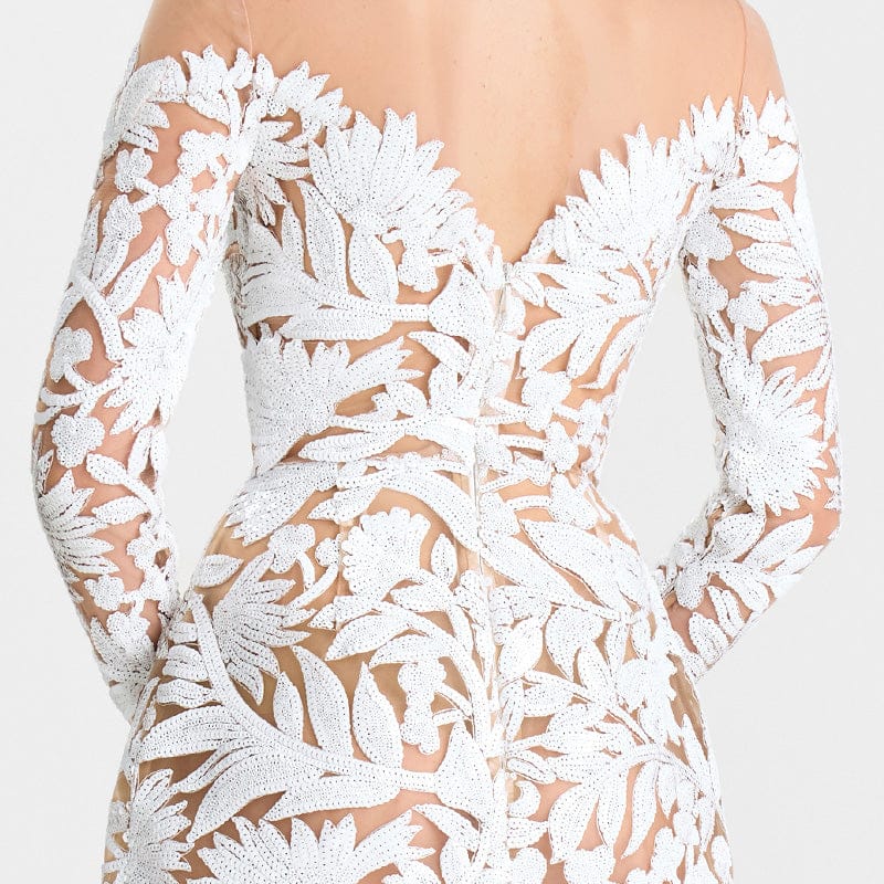 White lace dress with floral patterns on a white background